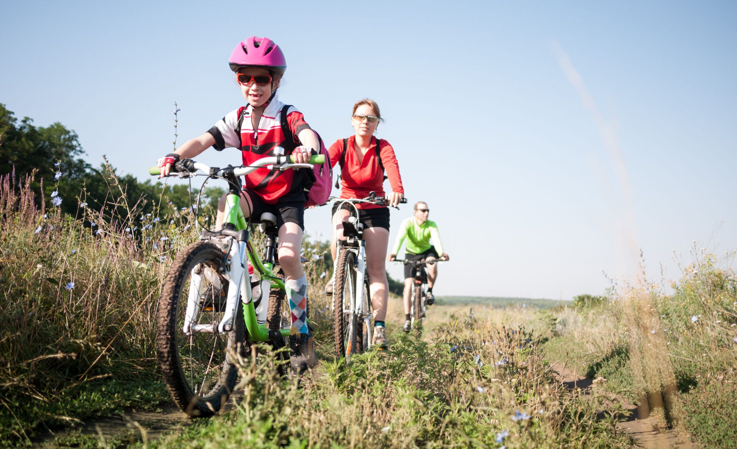 family cycling outdoors